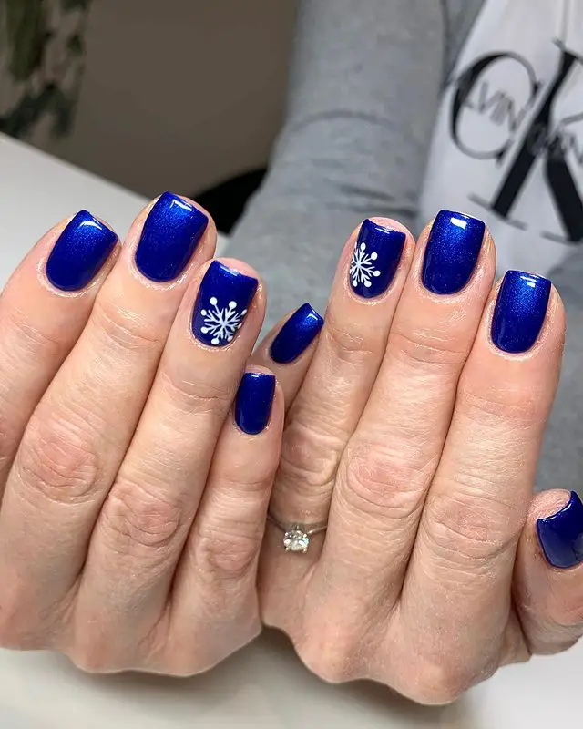 Electric Blue Nails with Snowflake Art