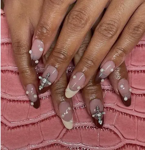 brown french tip nails with rhinestones