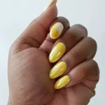 Yellow chrome nails